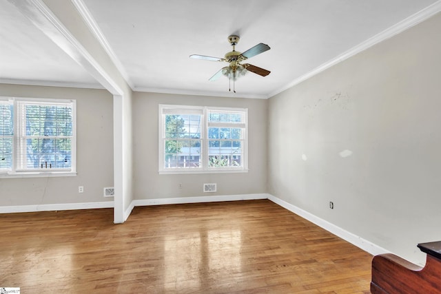 unfurnished room with ornamental molding, ceiling fan, and hardwood / wood-style floors