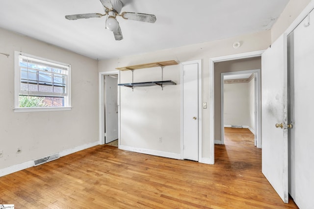 unfurnished bedroom with light wood-type flooring and ceiling fan