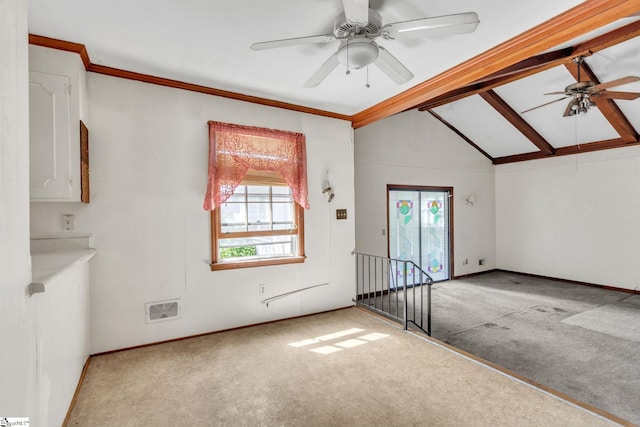 interior space featuring carpet floors, lofted ceiling with beams, and ceiling fan