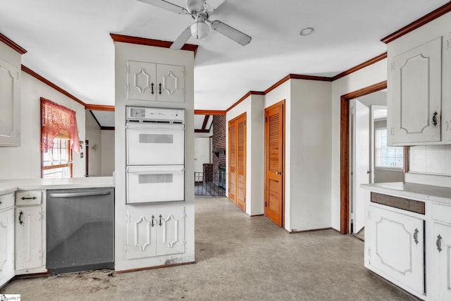 kitchen featuring white cabinets, double oven, ornamental molding, and dishwasher