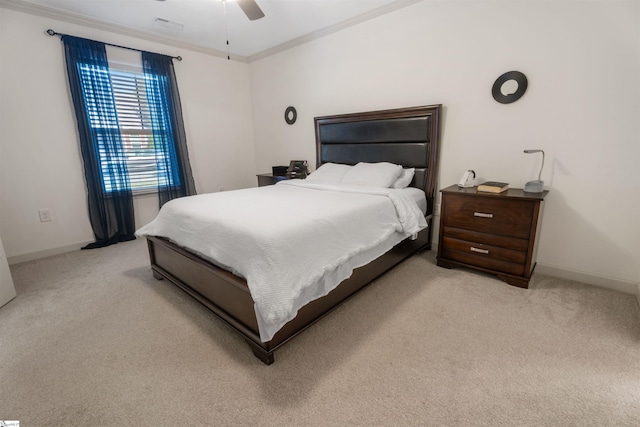 bedroom featuring ceiling fan, light carpet, and ornamental molding