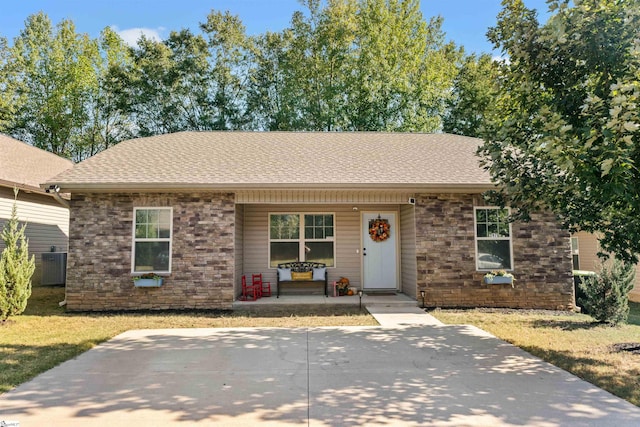 view of front of home featuring covered porch and central AC unit