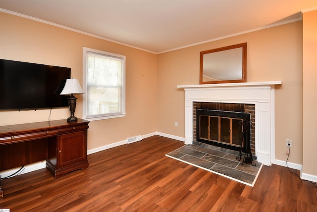 living room with crown molding, a fireplace, and dark hardwood / wood-style flooring