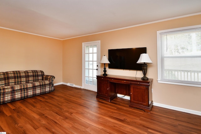 living room with hardwood / wood-style flooring and crown molding