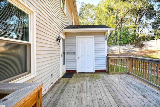 wooden deck with a storage shed