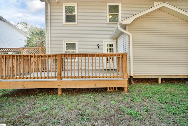 rear view of house featuring a deck