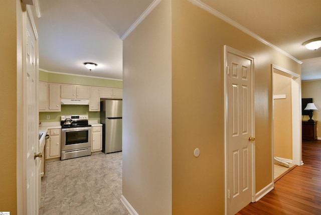 hall featuring light wood-type flooring and crown molding