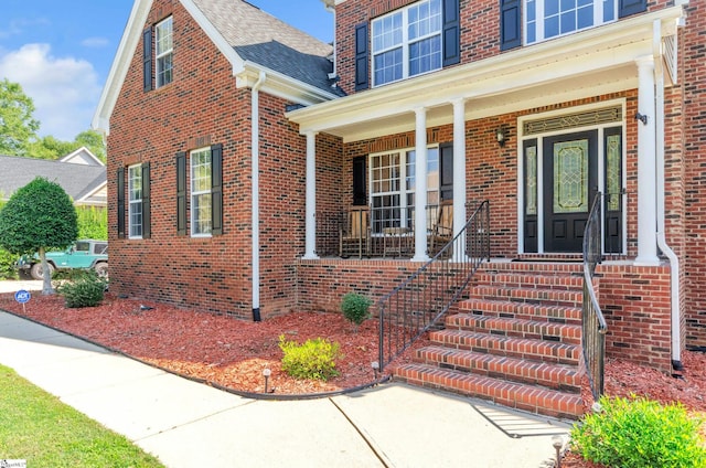 entrance to property with a porch