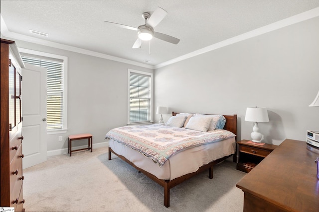 bedroom with light colored carpet, multiple windows, and ceiling fan