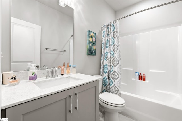 full bathroom featuring vanity, shower / tub combo with curtain, and toilet