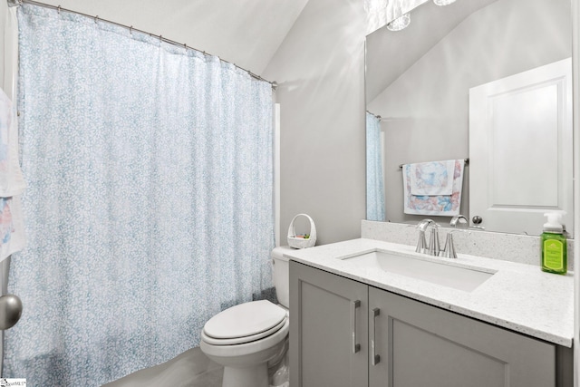 full bathroom featuring lofted ceiling, shower / bath combo, vanity, and toilet