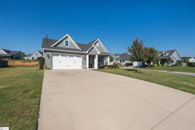 view of front facade featuring a front yard and a garage