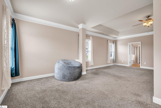 living area with ceiling fan, carpet flooring, and ornamental molding