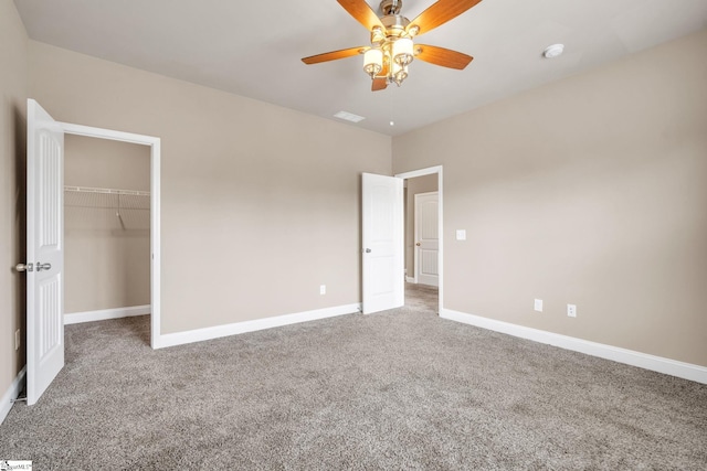 unfurnished bedroom with ceiling fan, a closet, and carpet