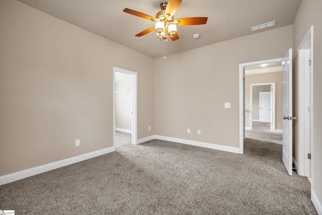 spare room featuring carpet floors and ceiling fan