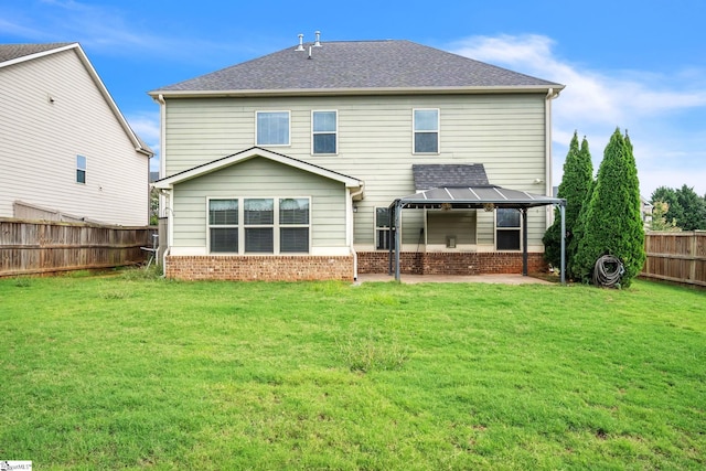 back of property featuring a yard and a patio area