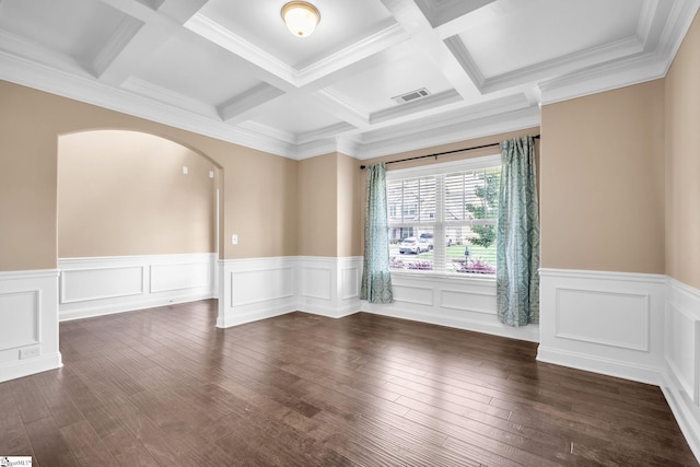 empty room with dark hardwood / wood-style floors, beamed ceiling, coffered ceiling, and crown molding