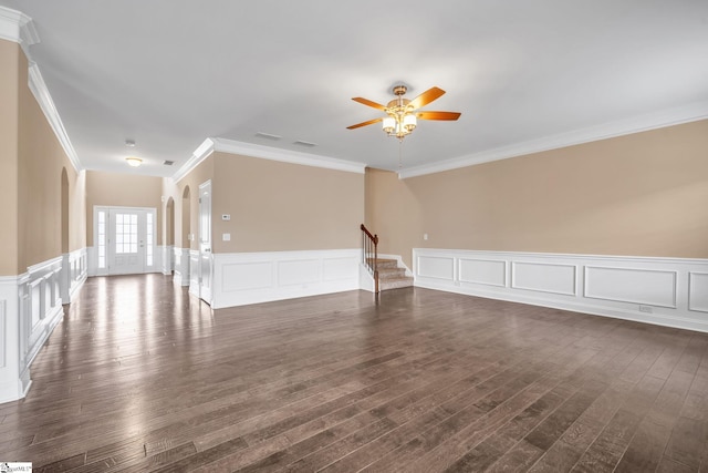 unfurnished room with crown molding, ceiling fan, and dark hardwood / wood-style flooring