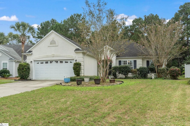 single story home with a garage and a front lawn