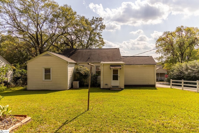 back of property with a yard