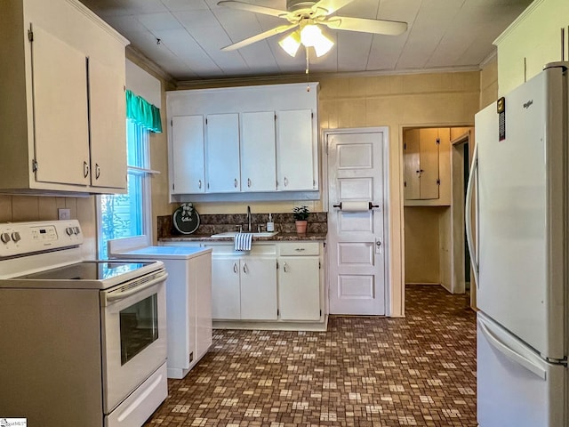 kitchen featuring ceiling fan, white appliances, sink, white cabinetry, and ornamental molding