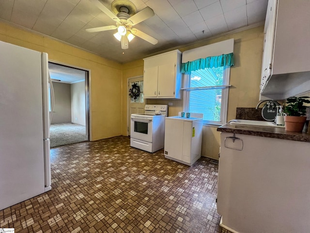 kitchen with ceiling fan, white appliances, sink, ornamental molding, and white cabinetry