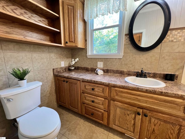 bathroom with tile patterned flooring, backsplash, vanity, and toilet