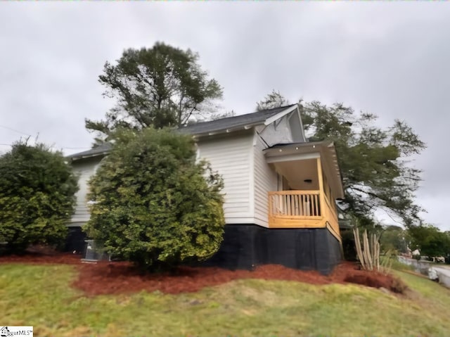 view of side of home with a balcony