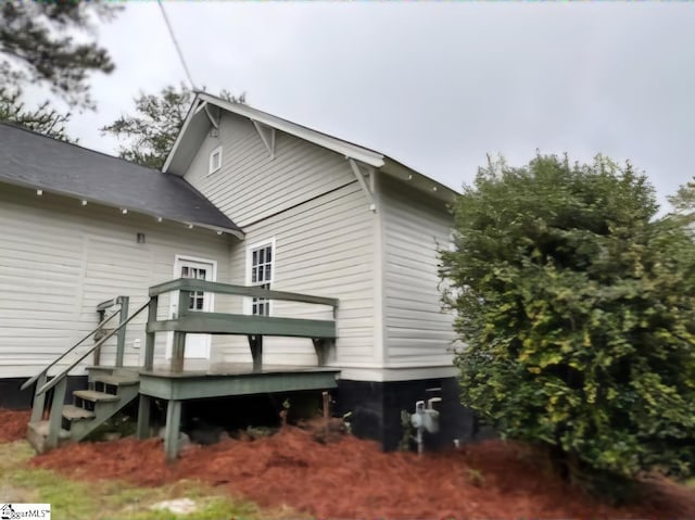 rear view of house with a deck