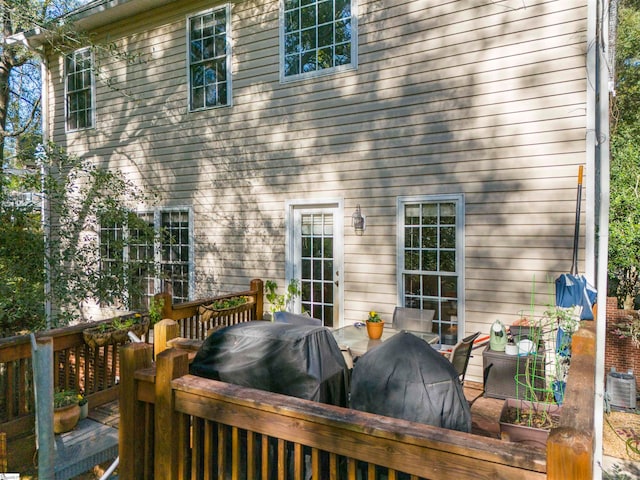 back of house with a wooden deck