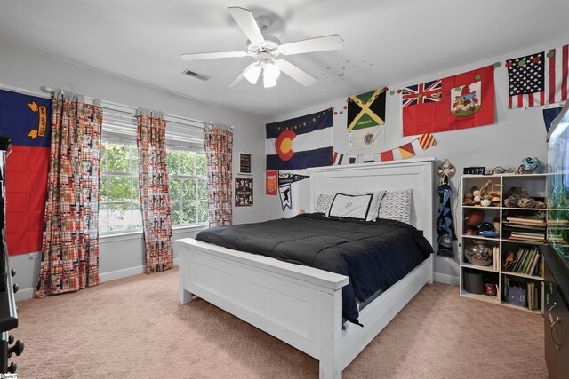 carpeted bedroom with ceiling fan