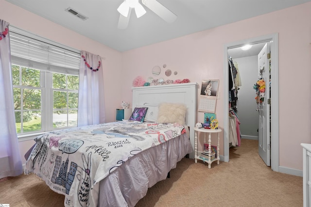 bedroom with ceiling fan and light colored carpet