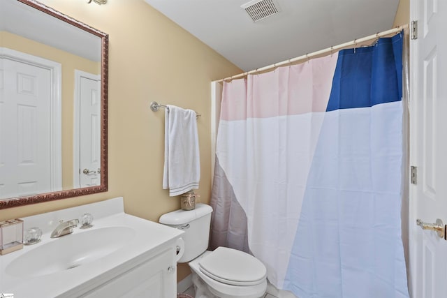 bathroom with vanity, toilet, and a shower with shower curtain