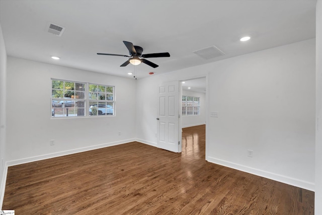 unfurnished room featuring ceiling fan and dark hardwood / wood-style floors