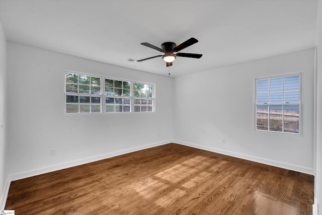 unfurnished room with ceiling fan and hardwood / wood-style floors