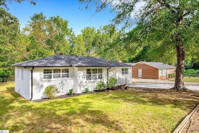 exterior space with a front lawn