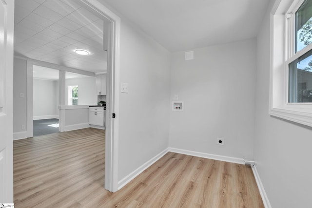 laundry area with light wood-type flooring, electric dryer hookup, and hookup for a washing machine