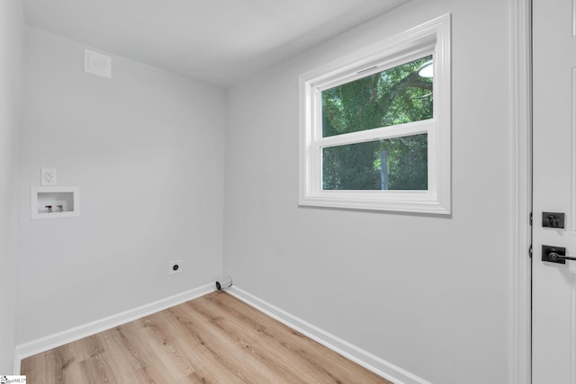 washroom with light wood-type flooring, hookup for a washing machine, and hookup for an electric dryer