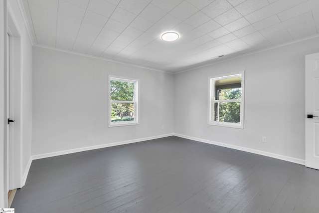 unfurnished room with dark wood-type flooring and ornamental molding