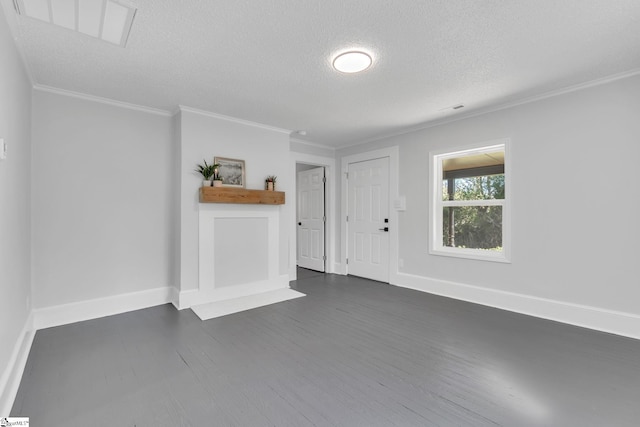 unfurnished living room with dark wood-type flooring, a textured ceiling, and crown molding