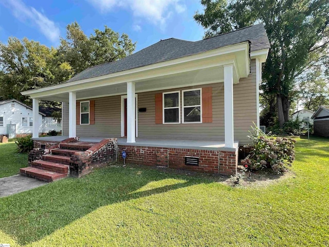 bungalow-style home with a front lawn and a porch