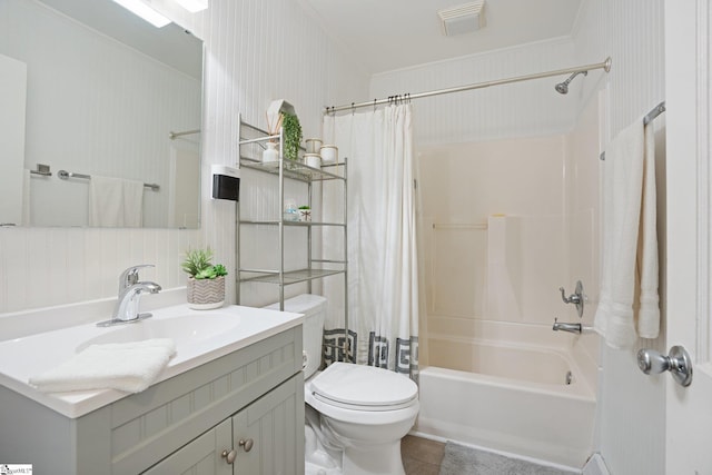 full bathroom with toilet, shower / bath combo with shower curtain, tile patterned floors, ornamental molding, and vanity