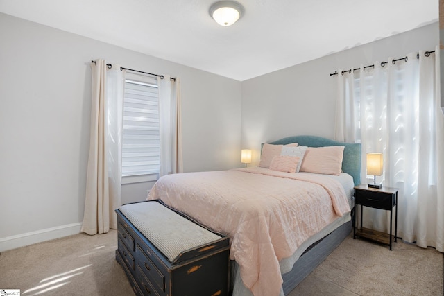 bedroom with light carpet