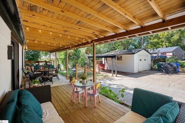 wooden deck with a patio and a shed