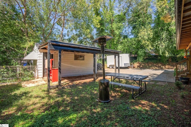 view of yard with a shed and a patio area