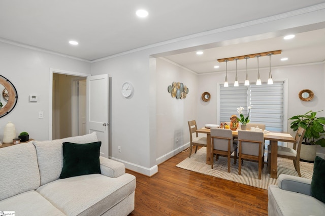 dining space featuring ornamental molding and dark hardwood / wood-style floors