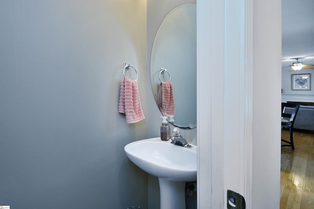 bathroom featuring sink, hardwood / wood-style flooring, and ceiling fan