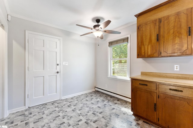 kitchen with ceiling fan, baseboard heating, and crown molding