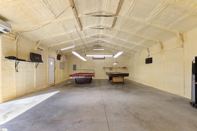 garage with a wall mounted air conditioner