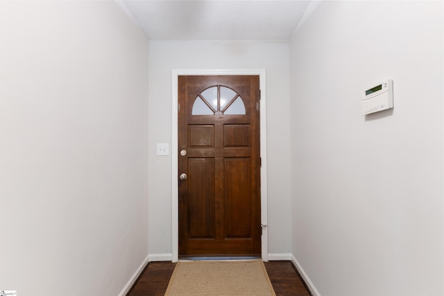 entryway with dark hardwood / wood-style floors